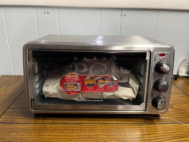 Hamilton Beach 8Mode Sure-Crisp Air Fry Toaster Oven, silver, new condition, features air fry function, model TOASTER OVEN.