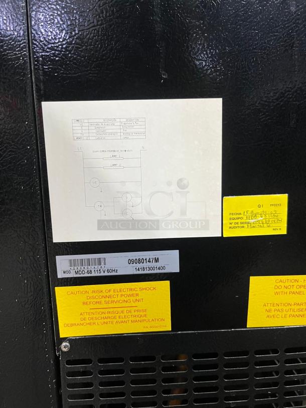 Micro Matic MDD68-E draft beer cooler's back panel displaying model label and caution tags, in good condition.