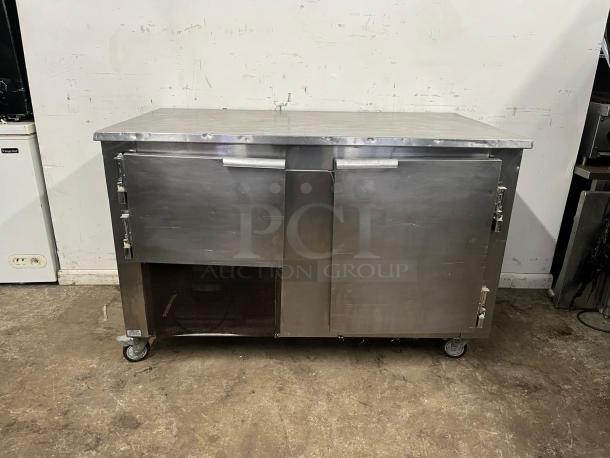 LEADER LB60 60" Low Boy Worktop Refrigerator, stainless steel, two-door, caster wheels, visible wear, industrial use.