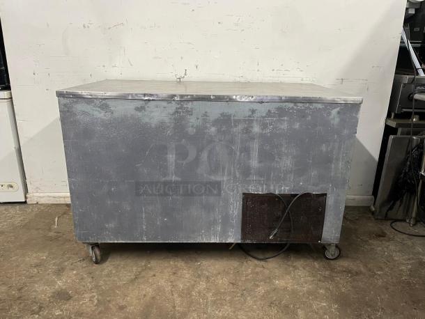 LEADER LB60 60" Low Boy Worktop Refrigerator, industrial design, visible wear, caster wheels, plug attached, perfect for commercial use.