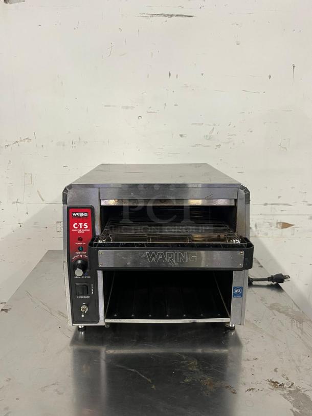 Waring CTS1000 Conveyor Toaster, 450 slices/hr, 2" opening, 120v, stainless steel, power and speed controls visible.
