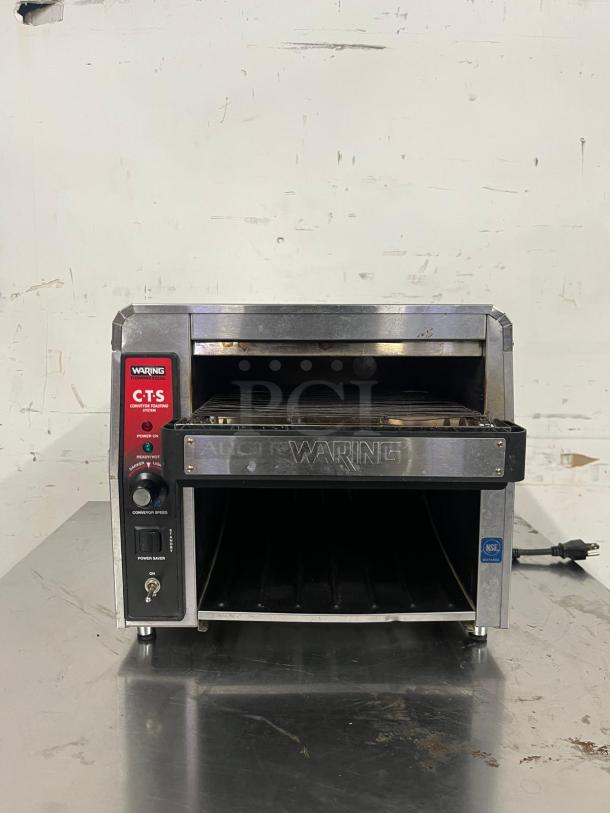 Waring CTS1000 conveyor toaster, 450 slices/hr, 2" opening, 120v, stainless steel, power switch, good condition, visible label.