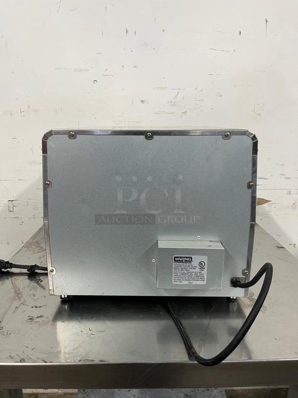 Waring CTS1000 Conveyor Toaster, 450 Slices/hr, visible power cord, maker label, silver exterior, good condition.