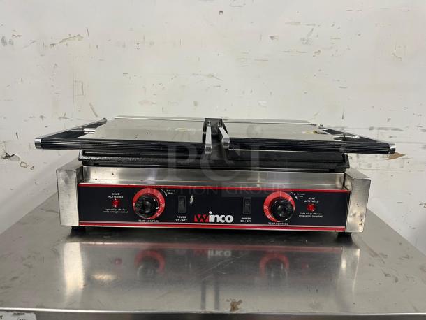 Winco ESG-2 double commercial sandwich press with cast iron smooth plates, 120v. Features temperature control dials, WINCO branding.