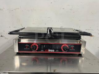 Winco ESG-2 double commercial sandwich press with cast iron smooth plates, 120v. Features temperature control dials, WINCO branding.