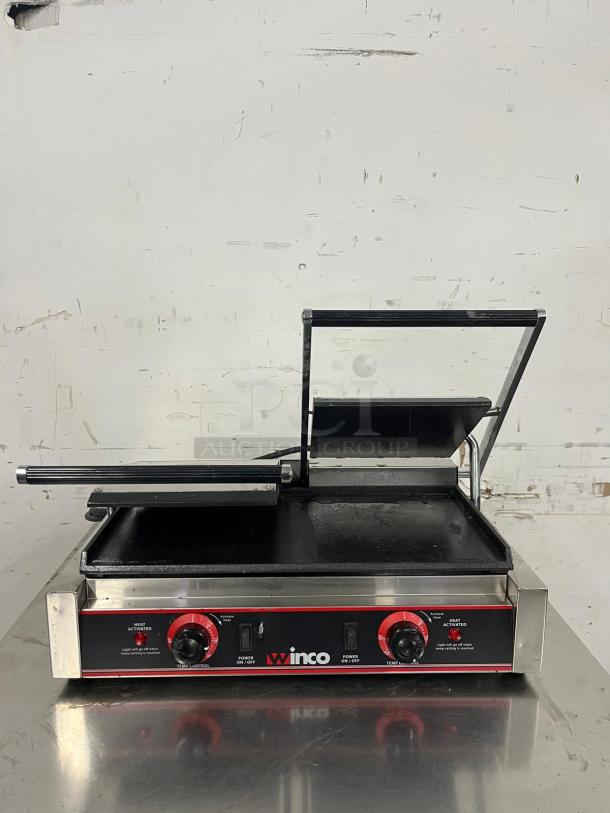 Winco ESG-2 Double Commercial Sandwich Press with smooth cast iron plates, 120v. Features dual controls, stainless steel body.