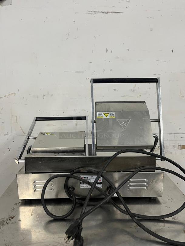 Winco ESG-2 double sandwich press with cast iron smooth plates, silver finish, power cord, visible branding label, 120v.