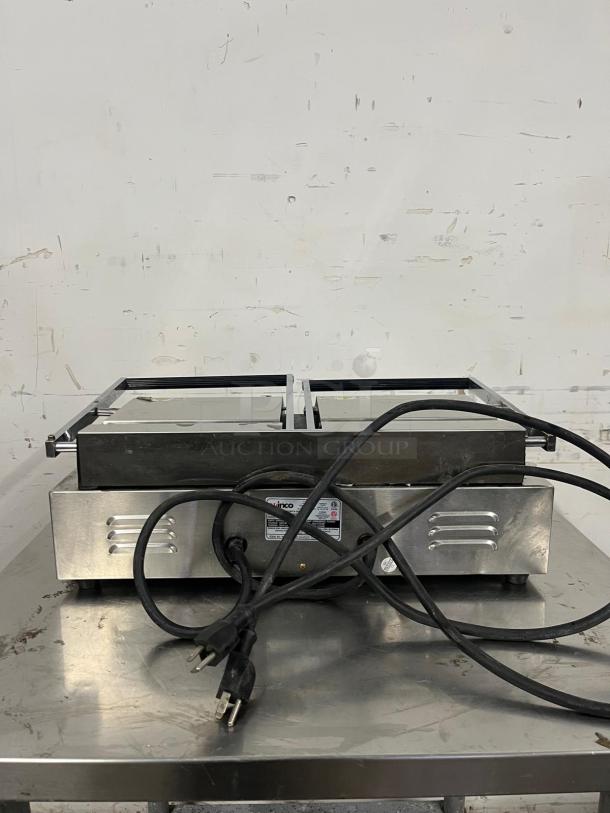 Winco ESG-2 Double Sandwich Press, cast iron smooth plates, 120v. Features dual plugs, good condition, visible brand label.