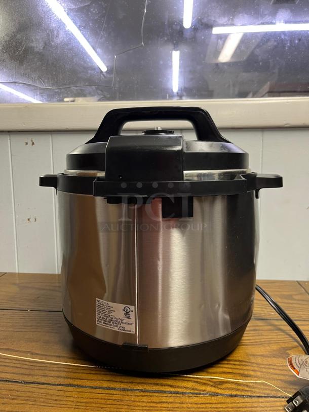 INSIGNIA 6QT Rice Cooker in stainless steel, with 12 programmable settings. Features durable handle. Model details on label.