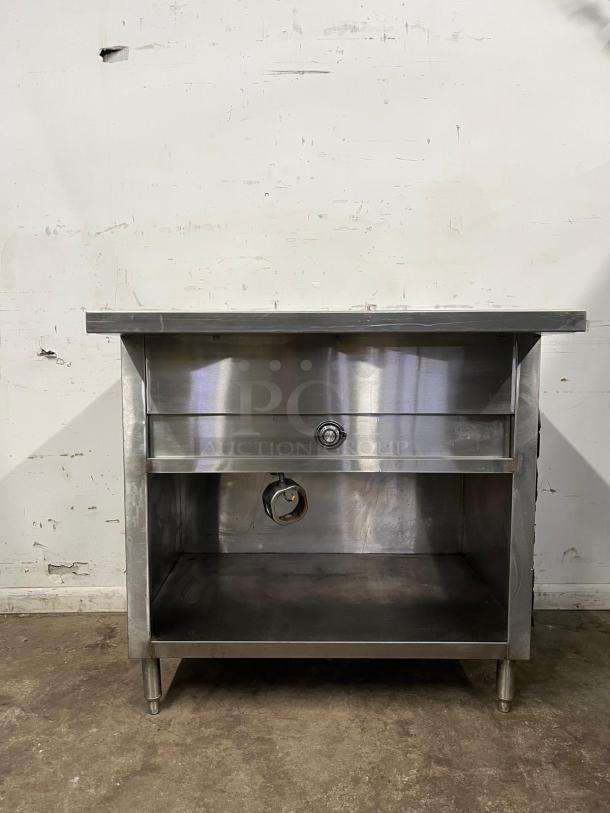 24" stainless steel steam table by STEAN TABLE, featuring open storage and valve indicator, in used condition.