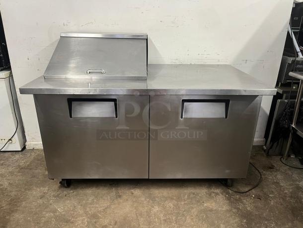 TRUE TSSU-60-12M-B-HC refrigerated sandwich prep table with 12 pans, stainless steel, two-door design, on casters.