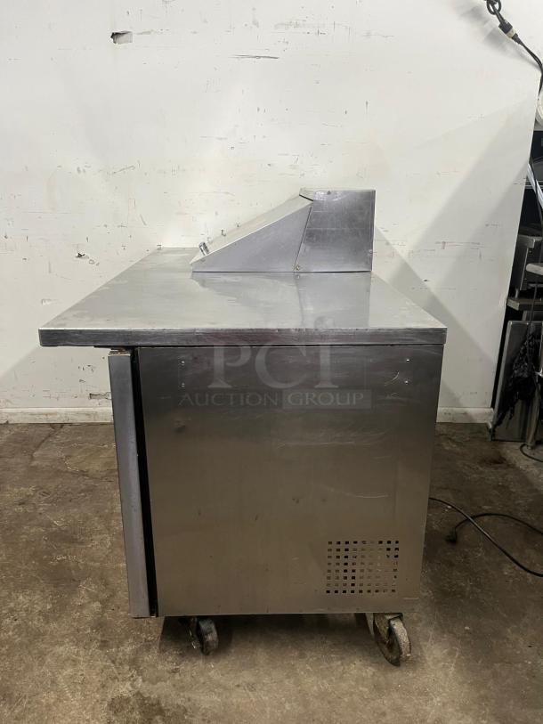TRUE TSSU-60-12M-B-HC refrigerated sandwich prep table, stainless steel, two doors, 12 pans, used condition.