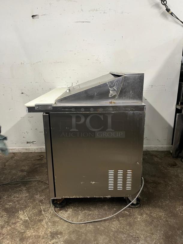 Blue Air BLMT48-HC 48" refrigerated sandwich prep table, stainless steel, 13.1 cu. ft., two swing doors, fair condition.