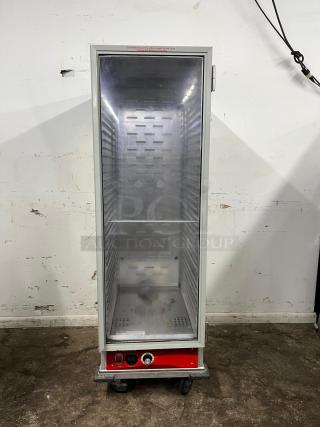 Avantco HEAT-1836 heated holding cabinet, full size, clear door, insulated, red base with controls, on caster wheels.