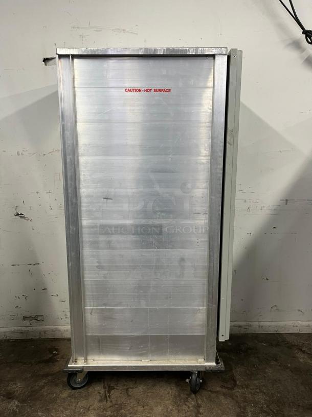 Avantco HEAT-1836 heated holding cabinet, full-size, insulated, clear door, 120V, silver finish, caution label visible.