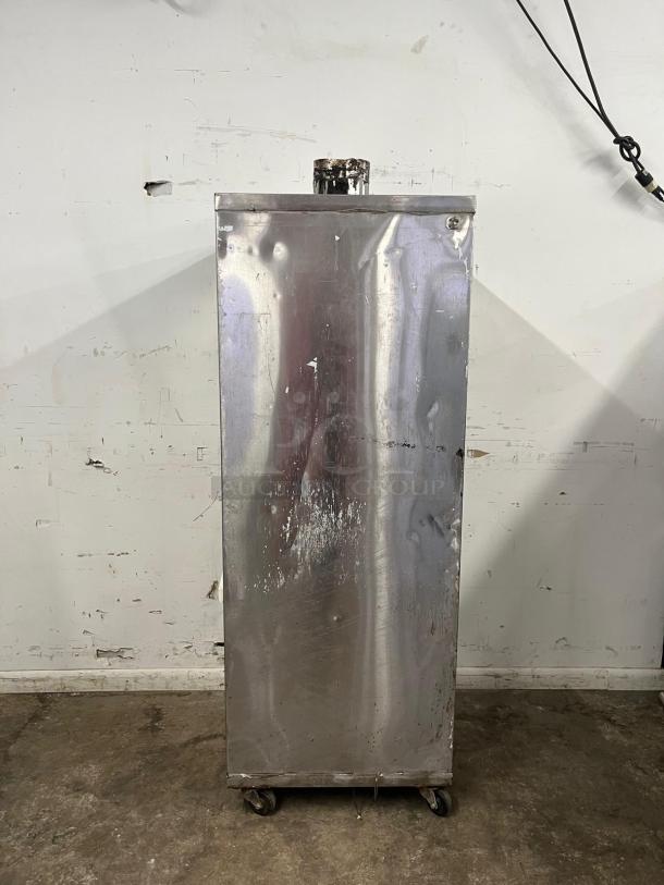 UNIVERSAL Smoker Oven, Model SMOKER, 78" galvanized interior, 3 burners. Features visible wear, on rolling casters.