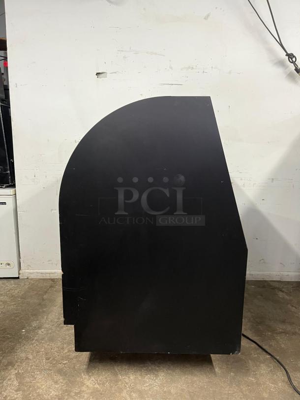 36" curved refrigerated display case with a black finish. Side view shown. Good condition, ideal for showcasing items.