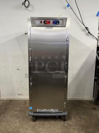 METRO C599-SDS-U heated holding/proofing cabinet, stainless steel, solid Dutch doors, full-size, on casters.