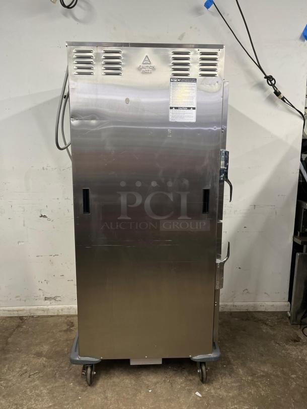 METRO C599-SDS-U heated holding/proofing cabinet with solid Dutch doors, stainless steel, on casters. "Caution Hot" label visible.