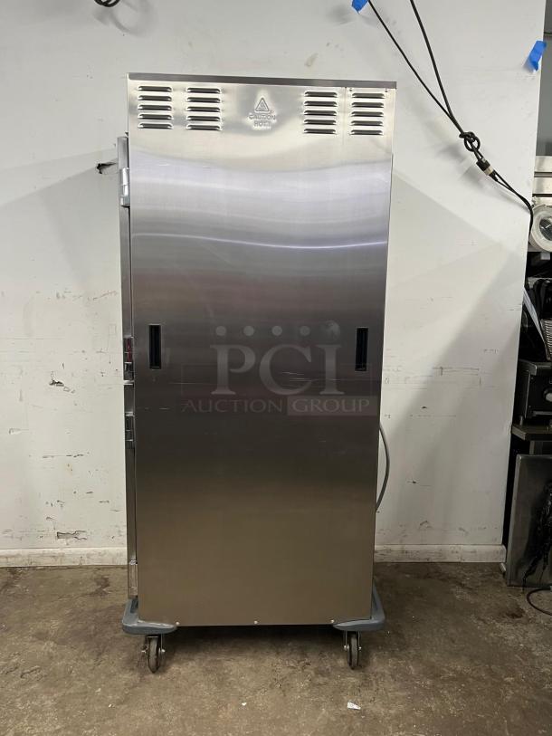 METRO C599-SDS-U heated cabinet, stainless steel, solid Dutch doors, on wheels, "Caution Hot" label, excellent condition.