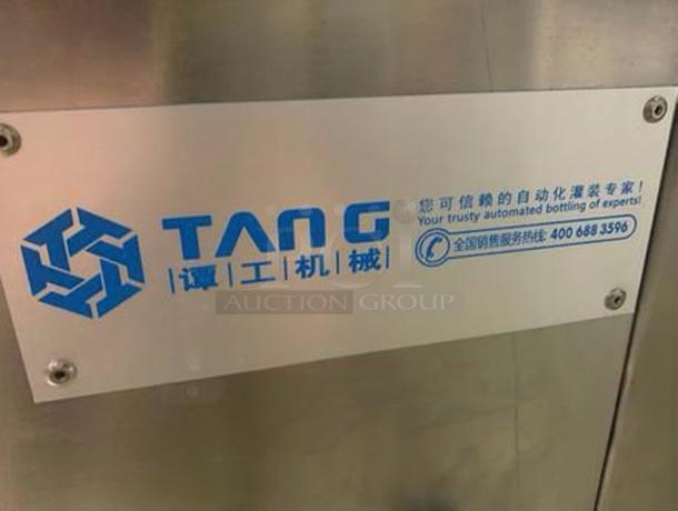 TANG Two-Head Automatic Filling Machine, premium condition, branded plate with logo and contact info; model TAN-L-FIL-0423.