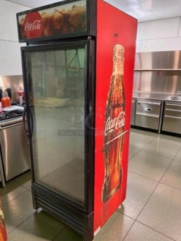 True GDM-26-HC-TSL01 glass door merchandiser, premium condition, vibrant Coca-Cola graphics, 115V, UL listed, fully tested.
