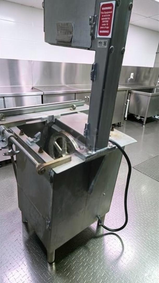 Hobart 5614 commercial meat saw, excellent condition, 2 HP, 3 phase, NSF certified, fully tested and operational, visible safety label.