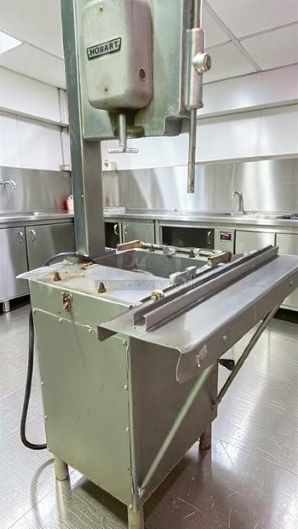 Hobart 5614 commercial meat saw, excellent condition, 2 HP, 3 phase, NSF certified, fully operational, visible brand marking.