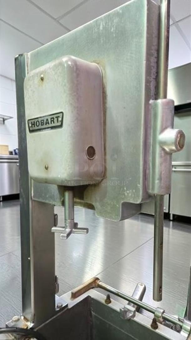 Hobart 5614 commercial meat saw, excellent condition, 2 HP, 3 phase, NSF certified, fully operational, Hobart logo visible.