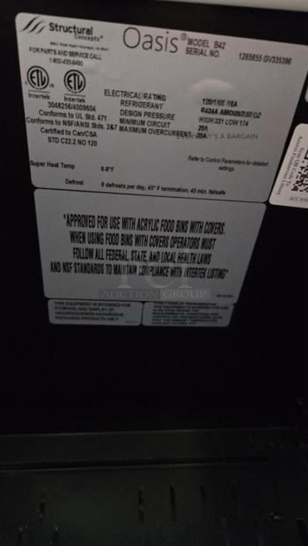 Structural Concepts Oasis B42 open air refrigerated merchandiser label, showcasing model, serial number, UL listing, and operational guidelines.