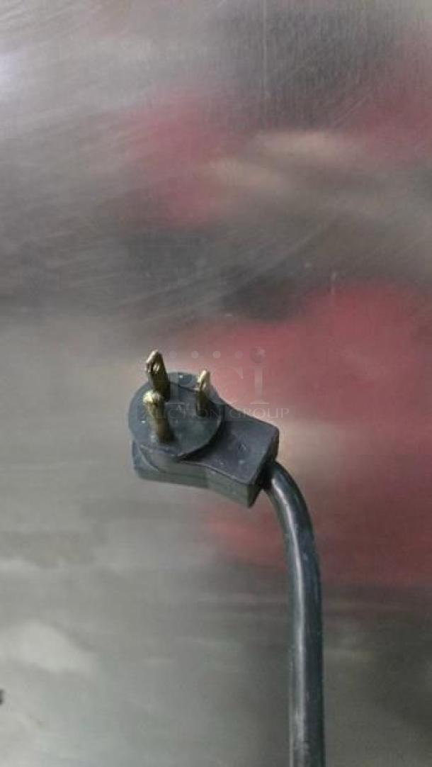 Close-up of power plug from Delfield 2-Section Reach-In Commercial Refrigerator, stainless steel, excellent condition.