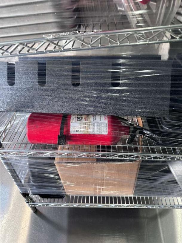 4-tier NSF chrome wire shelving rack, 36x18 in, with food pans and accessories. Premium condition, heavy-duty, inspected.