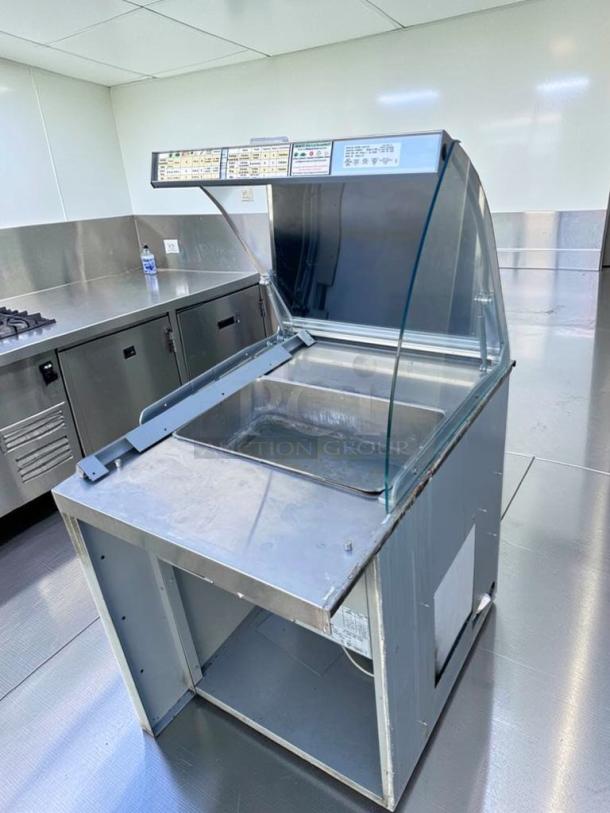 Duke SUB-HF-L25M heated food table with glass sneeze guard, stainless steel finish, fully tested, commercial-grade.
