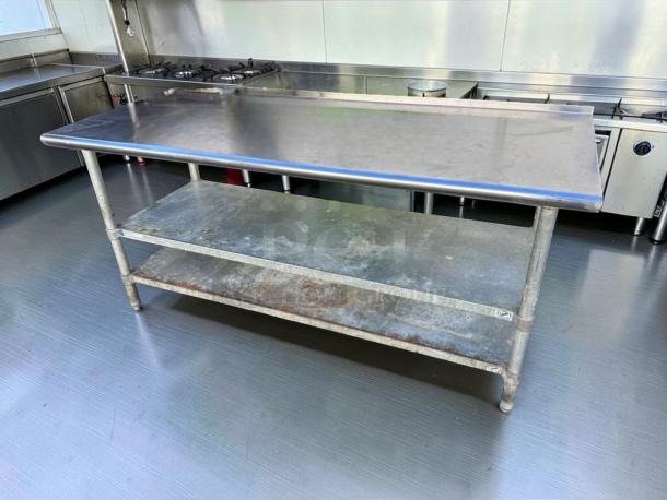 Commercial stainless steel work table with double undershelf, excellent condition, fully inspected, ready for use.