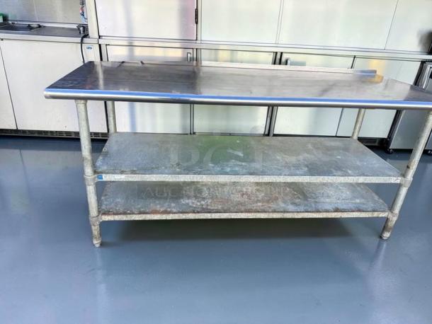 Commercial stainless steel work table, excellent condition, heavy-duty with double undershelf, fully inspected, model SST-M-TBL-0573.