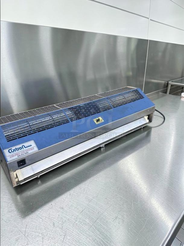 Curtain Products IBD-2-36-1-SS air curtain, UL listed, superb condition, fully tested, 36-inch commercial model on stainless steel table.
