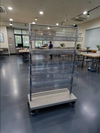 Commercial-grade multi-tier rolling wire display rack, heavy-duty, superior condition, model RET-S-RACK-0581, fully inspected.