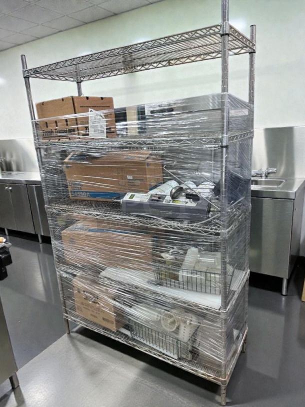 Commercial chrome wire shelving rack with contents, excellent condition, inspected and ready for use, STO-M-BUNDLE-0586.