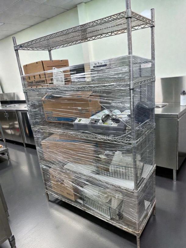 Commercial Chrome Wire Shelving Rack with contents, fully inspected, wrapped for preservation, ideal for restaurant use.