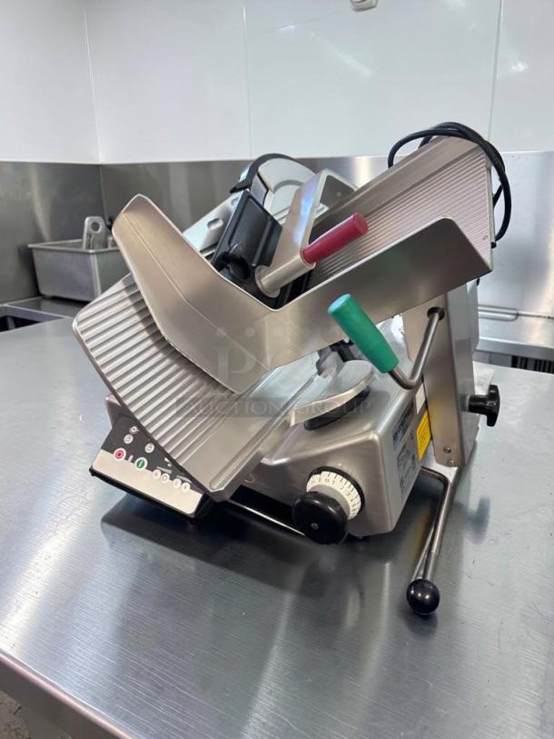 Bizerba N-22 commercial deli slicer, exceptional condition, fully tested, 120V. Features adjustment dial, power switch.