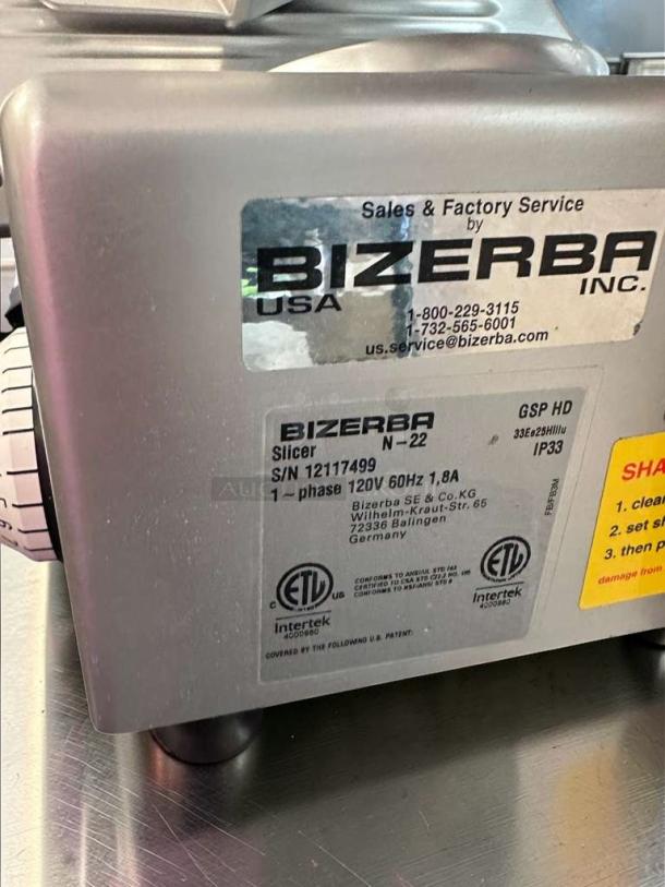 Bizerba N-22 commercial deli slicer, 120V, excellent condition, fully tested, model and service labels visible.