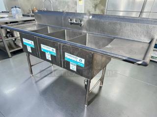 Immaculate 3-compartment stainless steel sink by Commercial Stainless Steel Fabrication, dual drainboards, NSF-certified.