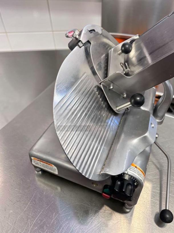Berkel 909/1 manual meat slicer in superb condition, 115V, NSF listed, fully operational with control panel and safety markings.