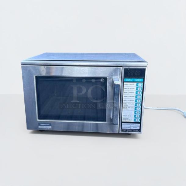Sharp R-22GT commercial microwave oven, 1200W, stainless steel, excellent condition, fully tested, with digital controls.