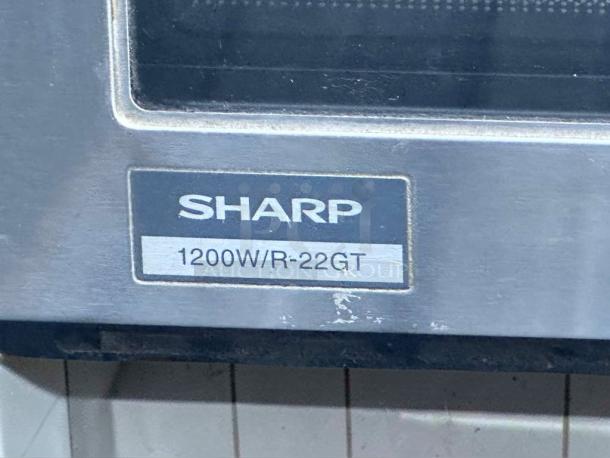 Sharp R-22GT microwave label showing 1200W power. Stainless steel exterior, fully tested, superb condition.