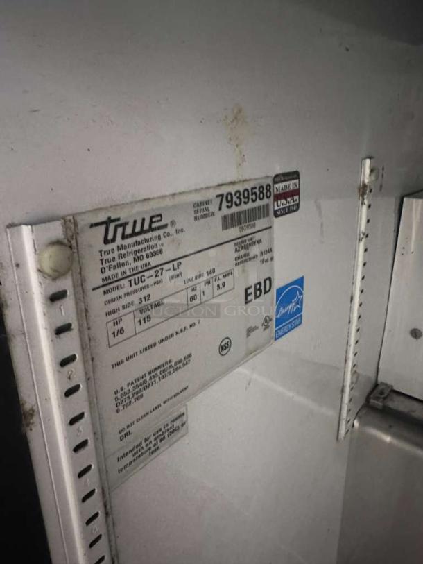 True TUC-27-LP undercounter refrigerator, stainless steel, exceptional condition, 115V, USA made, model label shown.