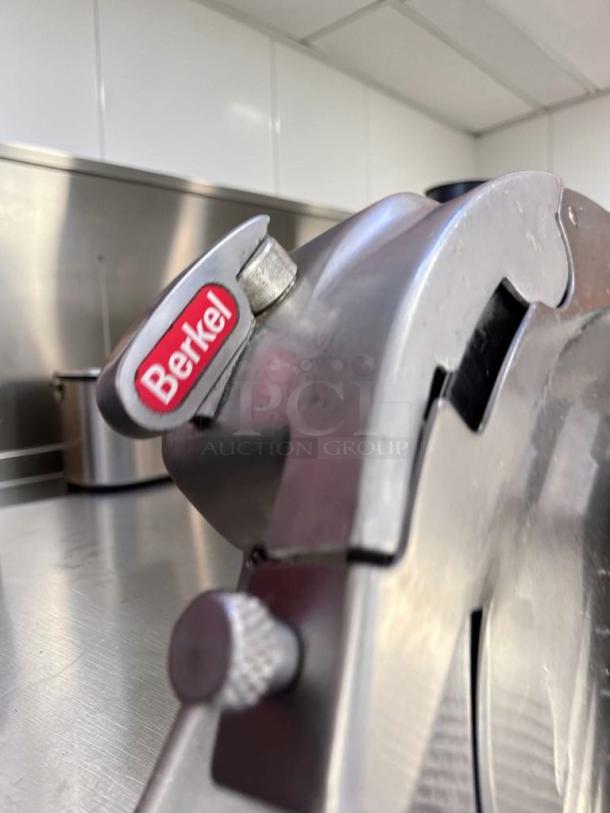 Berkel 909/1 commercial manual meat slicer in immaculate condition, NSF-certified, fully operational, visible brand logo.