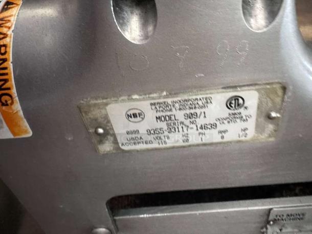 Berkel 909/1 commercial meat slicer label showing model, serial number, NSF mark, and electrical specifications.