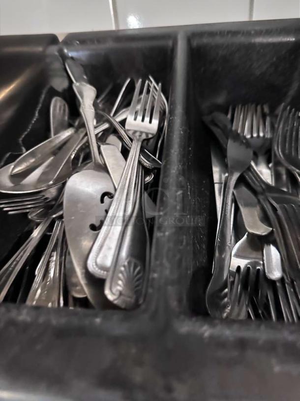 Commercial stainless steel flatware lot with mixed pattern forks and spoons in exceptional condition, ideal for restaurants.