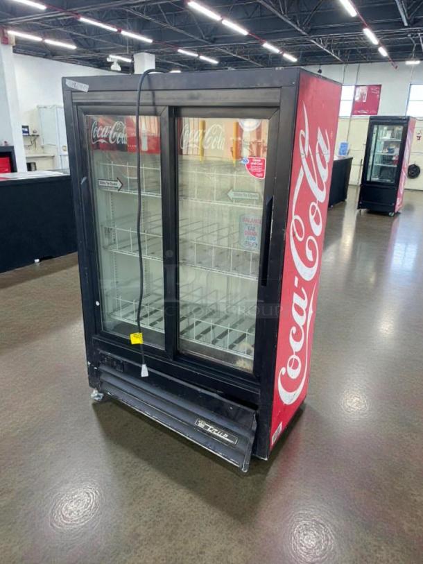 True GDM-33SSL Coca-Cola glass door merchandiser fridge, immaculate, fully tested, 115V, branding visible, USA-made.